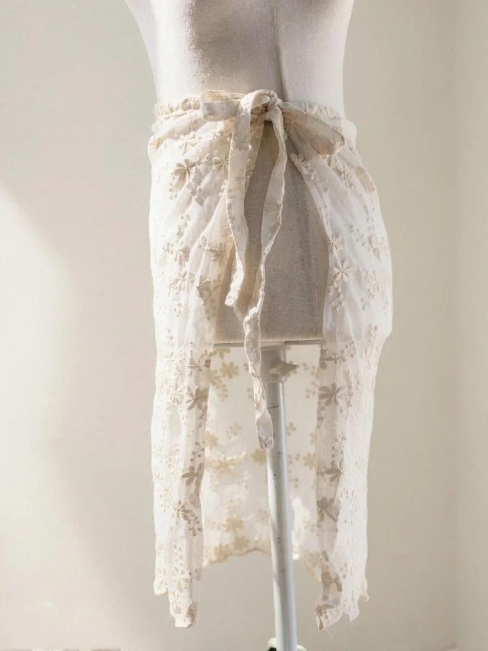 Y2k 2000s style white lace wrap skirt with floral embroidery and tie waist